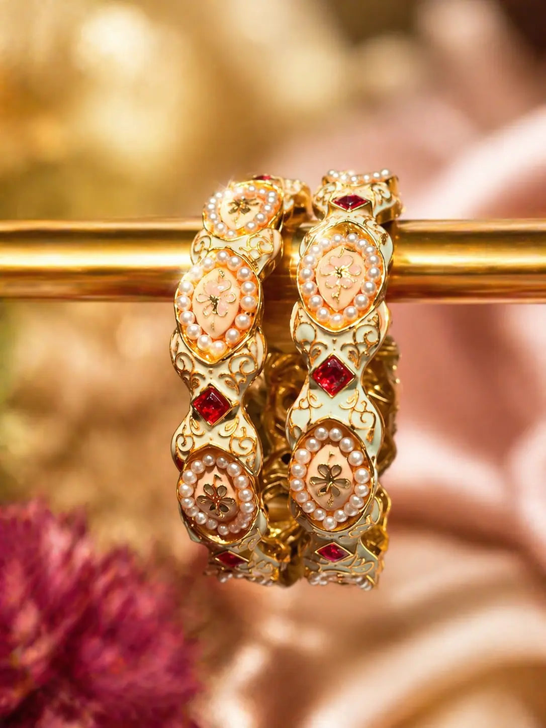 Floral pearl Kundan kara set with gold finish and red gemstone accents