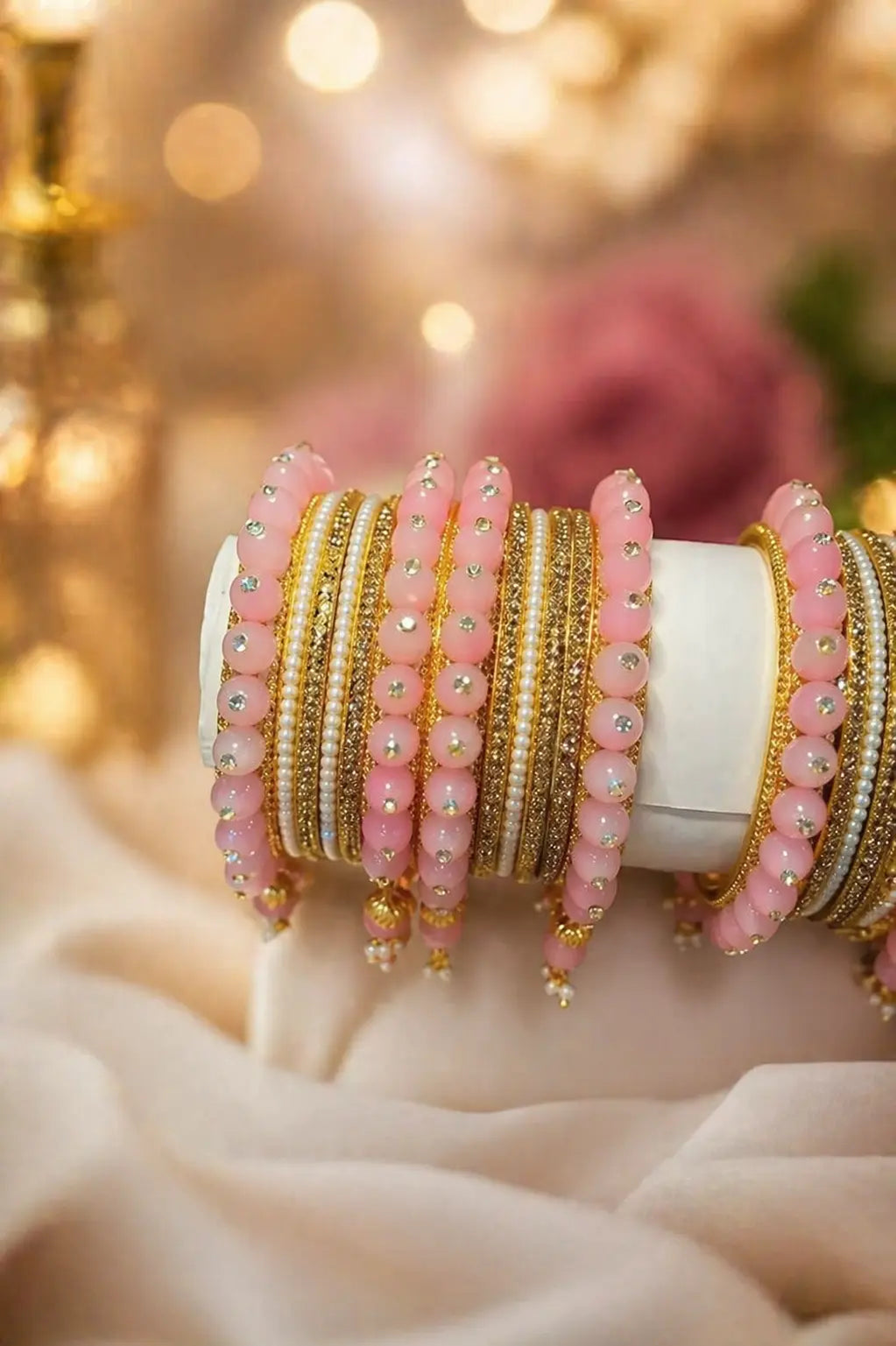 Pink pearl and gold bridal bangles with stone detailing