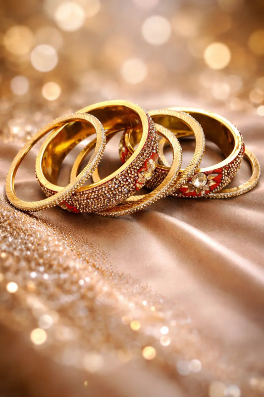 Gold bridal kara set with red stones and intricate detailing