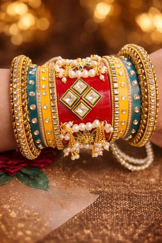 Multicolor Rajwadi bridal chura set with kundan stones, pearl details, and gold bangles