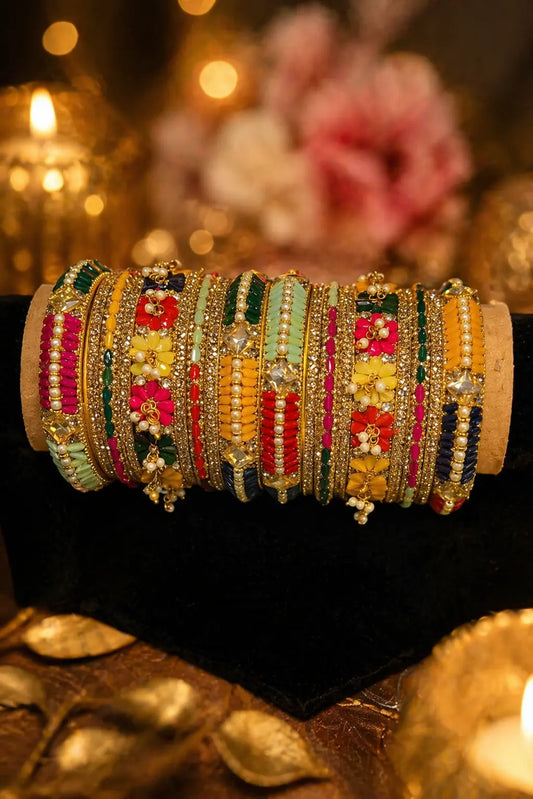 Multicolor bridal bangles set with floral designs and stone detailing